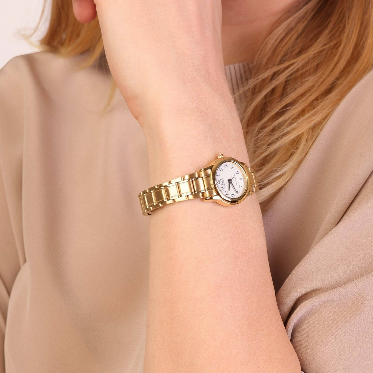 RELOJ QYQ DORADO